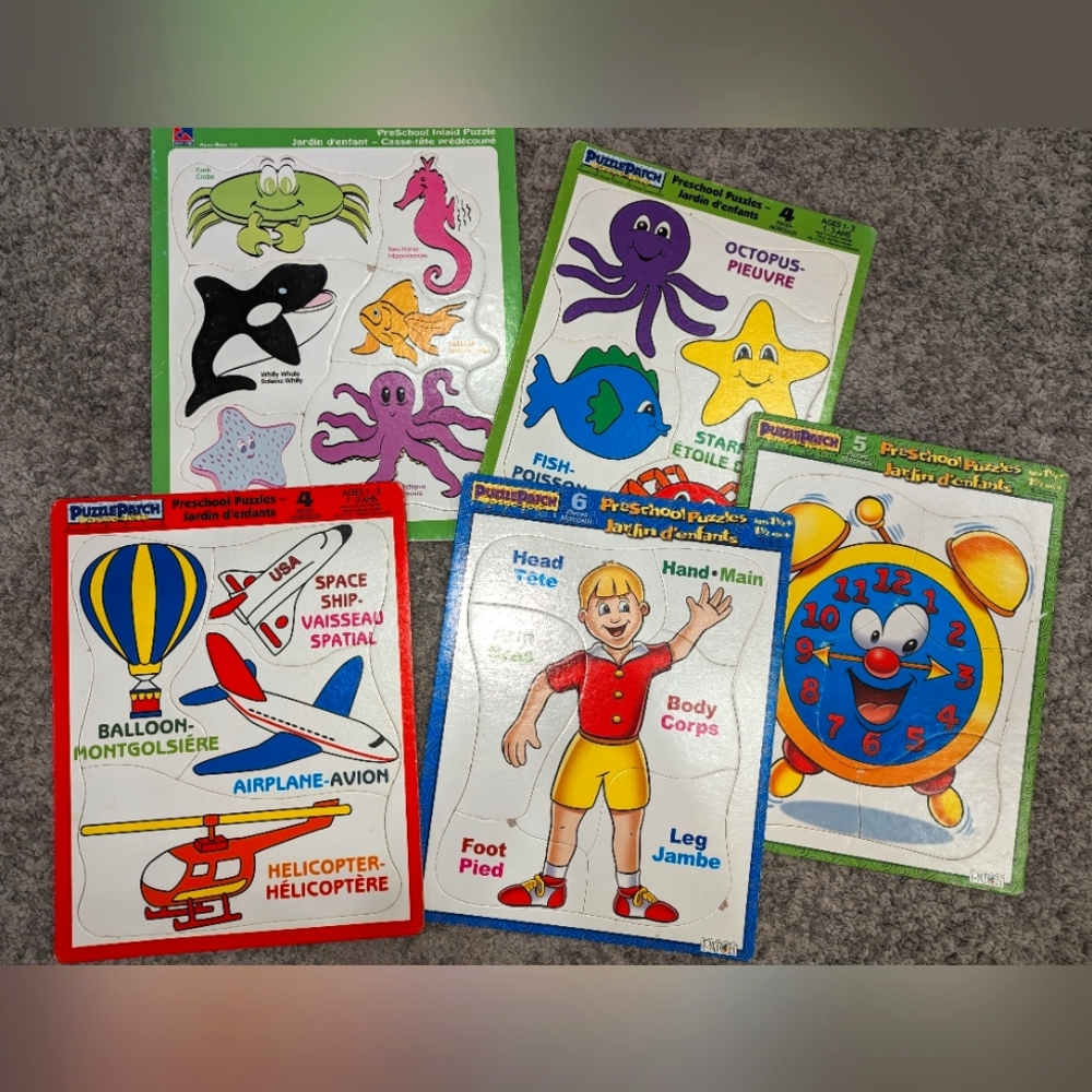 Set of 5 cardboard puzzles.